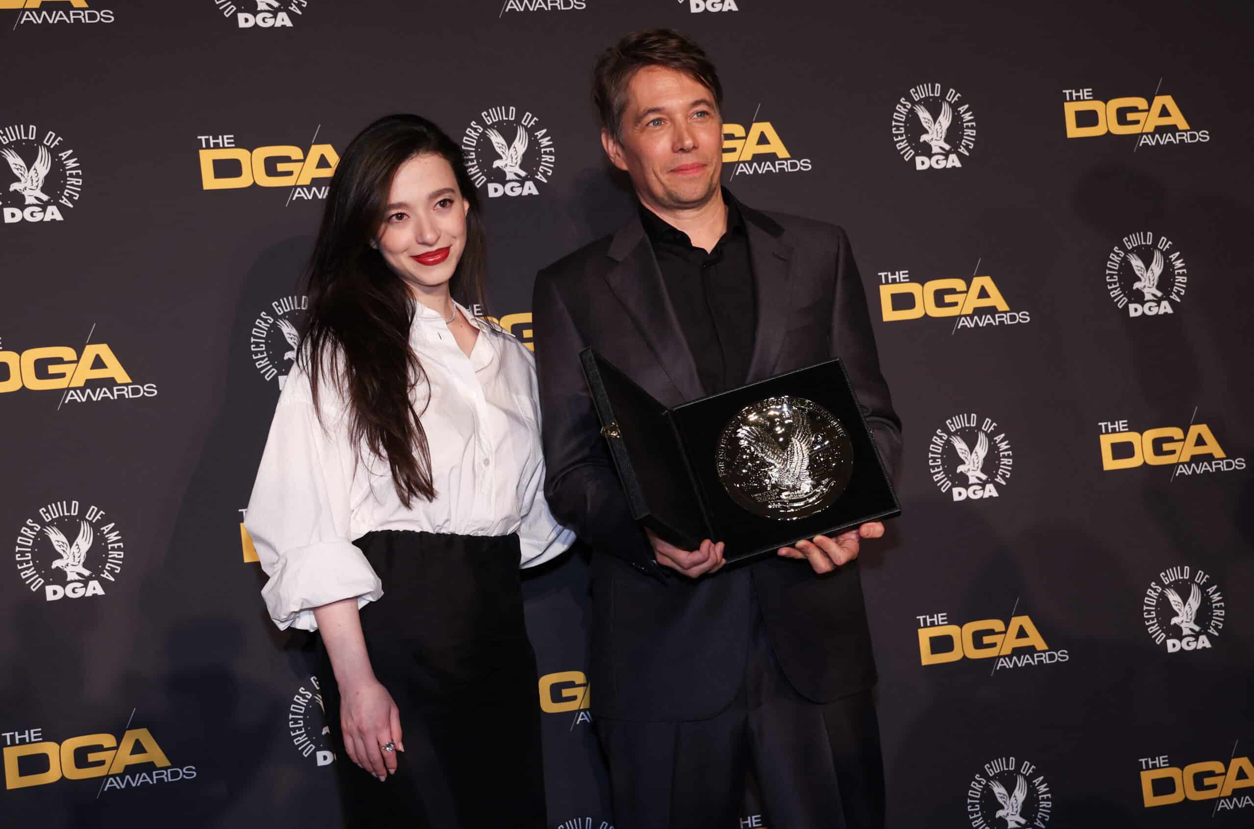 Mikey Madison and US director Sean Baker, pose in the press room with the silver medallion for his Directors Guild of America Theatrical Feature Film nomination for "Anora" during the 77th Annual DGA Awards at the Beverly Hilton hotel in Beverly Hills, California, February 8, 2025. Image: Valerie Macon/AFP